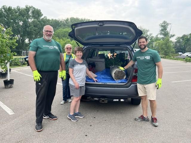 International Paper employee wearing a "Proud to be IP" shirt while supporting a community engagement event for the Arbor Day Foundation